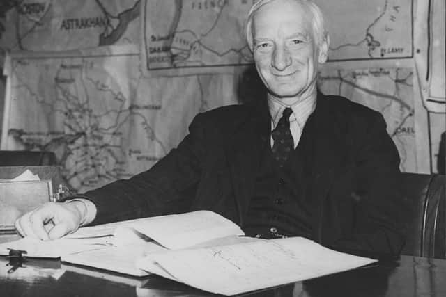British economist Sir William Beveridge (1879 - 1963) with his report on Social Security during a press conference at the Ministry of Information, London, 1st December 1942. (Photo by Central Press/Hulton Archive/Getty Images)