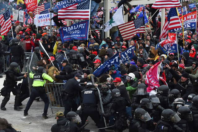 Trump supporters clash with police and security forces as they push barricades to storm the US Capitol in Washington DC on 6 January 2021. (Pic: Getty)