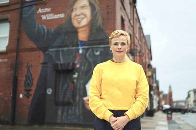 Maxine Peake standing in front of the Anne Williams mural (Credit: ITV/Amy Brammall)