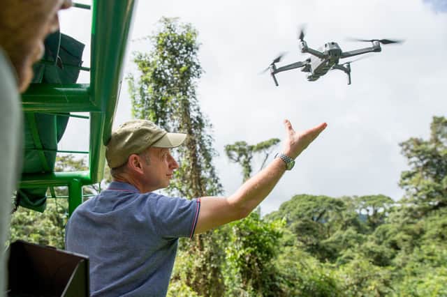 Camera operator Eric Huyton releases a filming drone to capture aerial views of the Costa Rican rainforest (Credit: BBC Studios/Paul Williams)