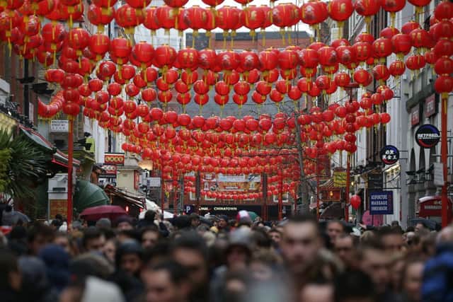 Chinese lanterns are put up during the Lantern Festival part of their New Year celebrations (image: AFP/Getty Images)