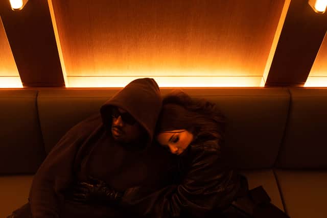 Ye and Julia chill on a sofa, snuggled closely together (Picture: Instagram/Interview)