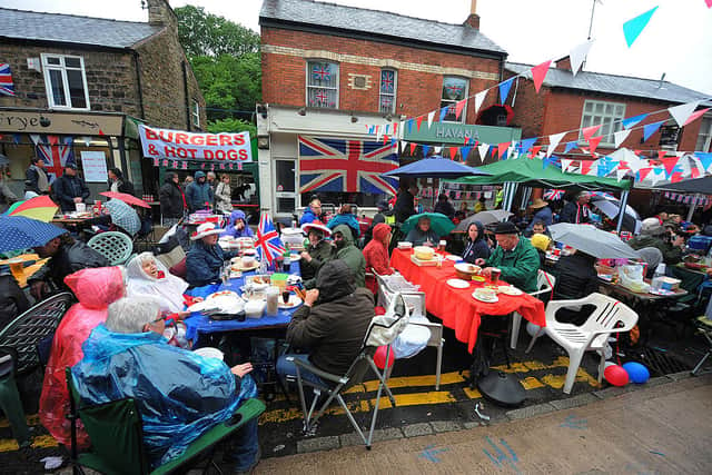 Manchester residents attend a Big Jubilee Lunch street party to celebrate the Diamond Jubilee in 2012 (Photo: ANDREW YATES/AFP/GettyImages)