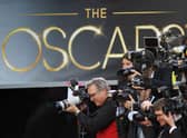 Photographers cover the red carpet arrivals to the 85th Annual Academy Awards in February 2012 (Photo: David McNew/Getty Images)