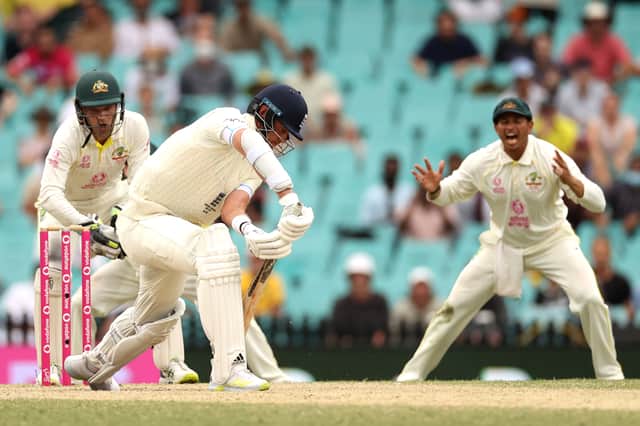 Stuart Broad of England blocks a ball during day five of the Fourth Test Match in the Ashes series between Australia and England at Sydney Cricket Ground on January 09, 2022 in Sydney, Australia
