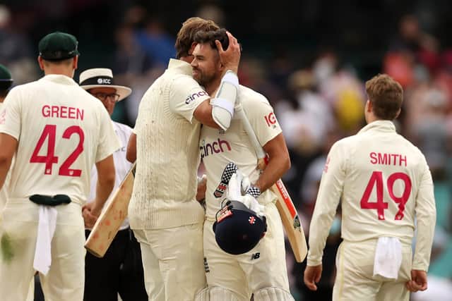 Jimmy Anderson and Stuart Broad of England embrace after the match ended in a draw on day five of the Fourth Test Match in the Ashes series between Australia and England at Sydney Cricket Ground on January 09, 2022