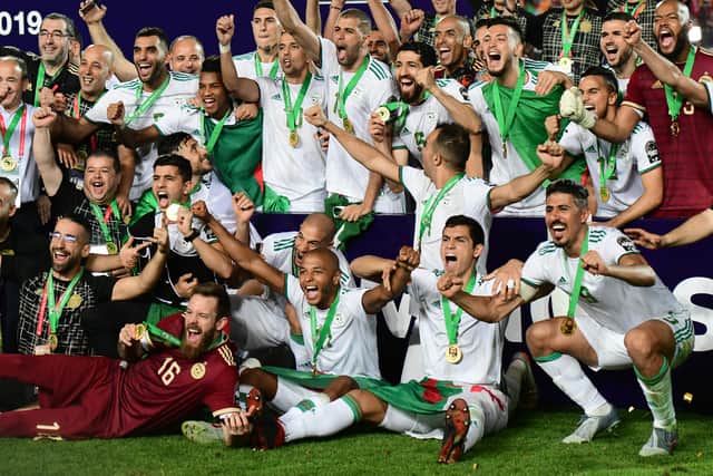 Algerian players celebrate after winning the 2019 Africa Cup of Nations (CAN) Final football match between Senegal and Algeria at the Cairo International Stadium in Cairo on July 19, 2019.