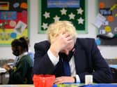 Boris Johnson speaks with pupils in a maths class as he makes a constituency visit to Oakwood School in Uxbridge (Photo: Leon Neal/Getty Images)