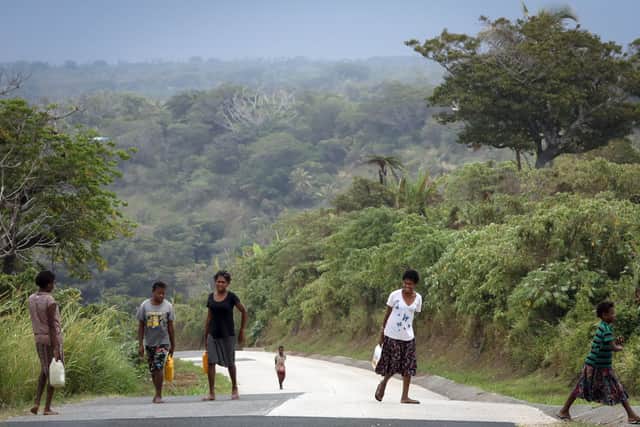 Natives carry water back to their village in Tanna, Vanuatu (Picture: Getty Images)