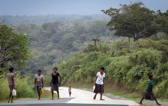 Natives carry water back to their village in Tanna, Vanuatu (Picture: Getty Images)