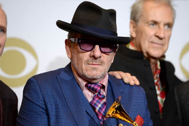 Elvis Costello & the Imposters pose in the press room during the 62nd Annual GRAMMY Awards (Photo: Amanda Edwards/Getty Images)