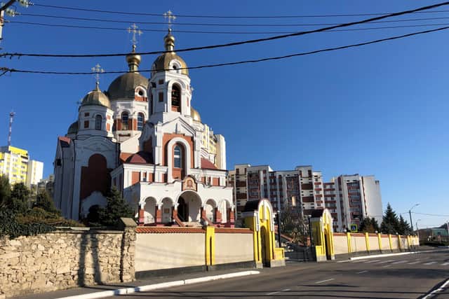 An Orthodox Church framed by communist era apartment blocks - It looks as if it belongs in the Tsarist era but in fact was built in 2006