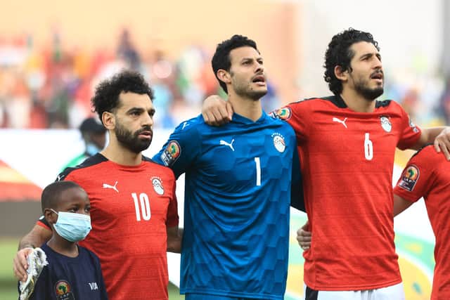 Egypt's forward Mohamed Salah (L), Egypt's goalkeeper Mohamed El Shenawy (C) and Egypt's defender Ahmed Hegazi (R) line up prior to the Group D Africa Cup of Nations (CAN) 2021 football match between Nigeria and Egypt at Stade Roumde Adjia in Garoua on January 11, 2022. 