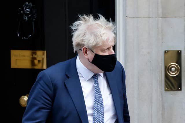 Prime Minister Boris Johnson leaves from 10 Downing Street on 12 January for Prime Minister’s Questions where he offered an apology for lockdown parties (Photo by TOLGA AKMEN/AFP via Getty Images)