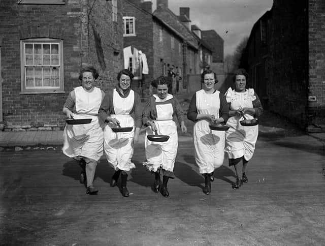 The annual pancake race in Olney, Buckinghamshire has been taking place for centuries (image: Getty Images)