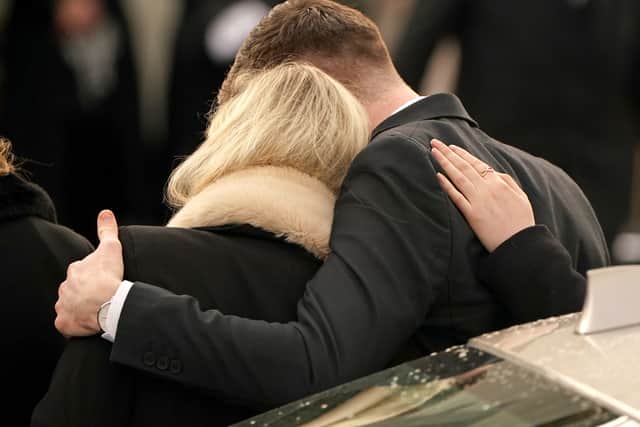 Ashling Murphy’s boyfriend Ryan Casey and sister Amy Murphy comfort each other as they arrive for her funeral (image: PA)