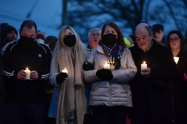 Murdered school teacher Ashling Murphys mother Kathleen Murphy , father Raymond Murphy, brother Cathal Murphy and sister Amy Murphy comfort one another as they attend a candle lit vigil near the scene of her murder on January 14 (image: Getty)