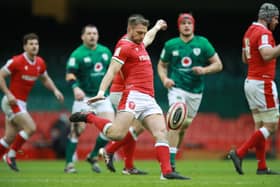 Dan Biggar of Wales clears the ball upfield  during the Guinness Six Nations match between Wales and Ireland at Principality Stadium on February 07, 2021 in Cardiff