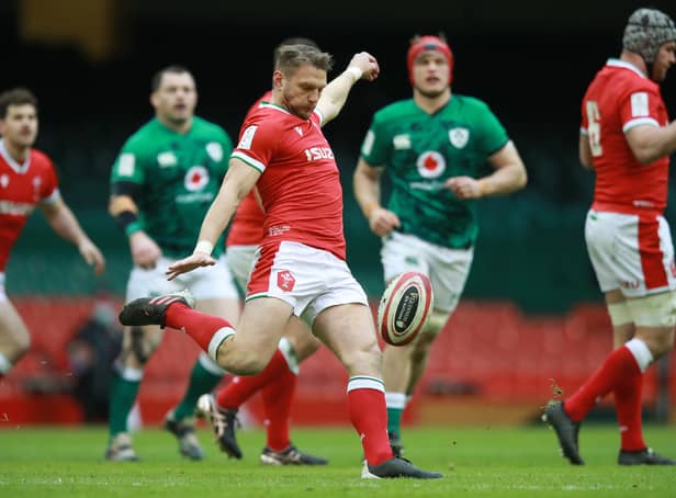 <p>Dan Biggar of Wales clears the ball upfield  during the Guinness Six Nations match between Wales and Ireland at Principality Stadium on February 07, 2021 in Cardiff</p>