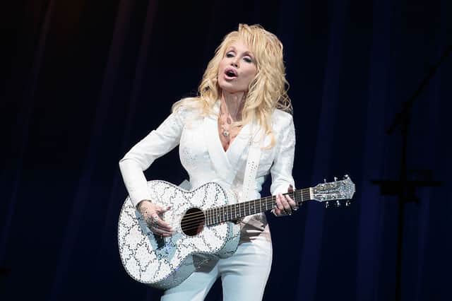 Dolly Parton performs in concert during her Pure & Simple Tour (Photo: SUZANNE CORDEIRO/AFP via Getty Images)