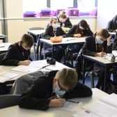 Face mask rules in schools vary across the UK (Photo: OLI SCARFF/AFP via Getty Images)