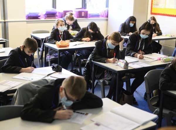 Face mask rules in schools vary across the UK (Photo: OLI SCARFF/AFP via Getty Images)