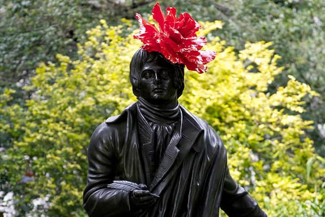 A statue of Scottish poet Robert Burns features a new hat on July 30, 2012, as an exhibition entitled ‘Hatwalk’ is unveiled in London, in celebration of the London 2012 Olympic Games (Photo: ANDREW COWIE/AFP/GettyImages)