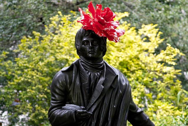 A statue of Scottish poet Robert Burns features a new hat on July 30, 2012, as an exhibition entitled ‘Hatwalk’ is unveiled in London, in celebration of the London 2012 Olympic Games (Photo: ANDREW COWIE/AFP/GettyImages)