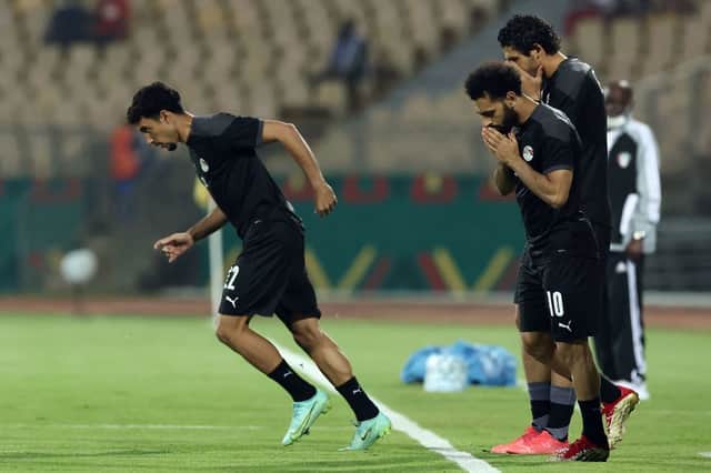 <p>Mohamed Salah and teammates. (Photo by KENZO TRIBOUILLARD/AFP via Getty Images)</p>