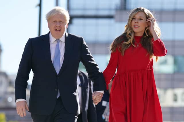 Prime Minister Boris Johnson with his wife Carrie who gave birth to their daughter Romy on 9 December (image: PA)