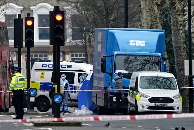 Metropolitan Police officers at the scene on Chippenham Road, Maida Vale, west London, where a woman was stabbed to death and a man killed after being hit by a car (image: PA)