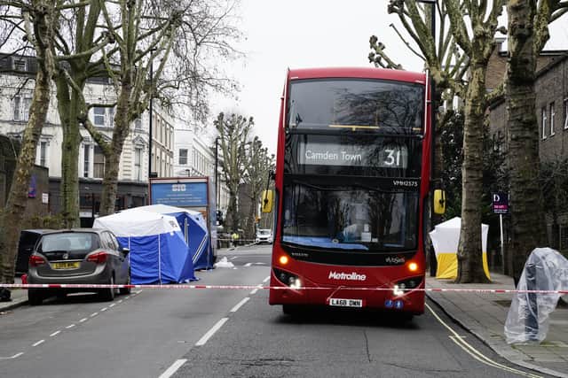Forensic tents (left) at the scene on Chippenham Road (image: PA)