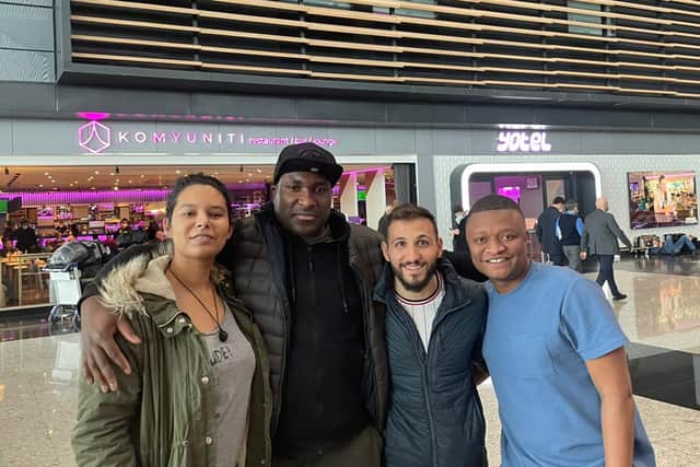 Football reporter Rahman Osman, right, with his new-found friends at Istanbul Airport. Credit: Rahman Osman
