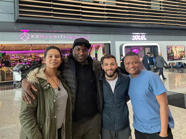 Football reporter Rahman Osman, right, with his new-found friends at Istanbul Airport. Credit: Rahman Osman