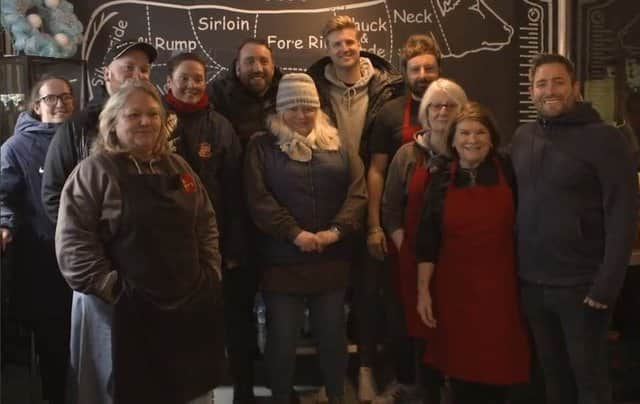 <p>Volunteers at the Sunderland Soup Kitchen were joined by Sunderland men and ladies managers Lee Johnson and Mel Reay</p>