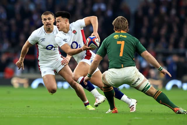Marcus Smith of England goes past Kwagga Smith during the Autumn Nations Series match between England and South Africa at Twickenham Stadium on November 20, 2021 in London, England