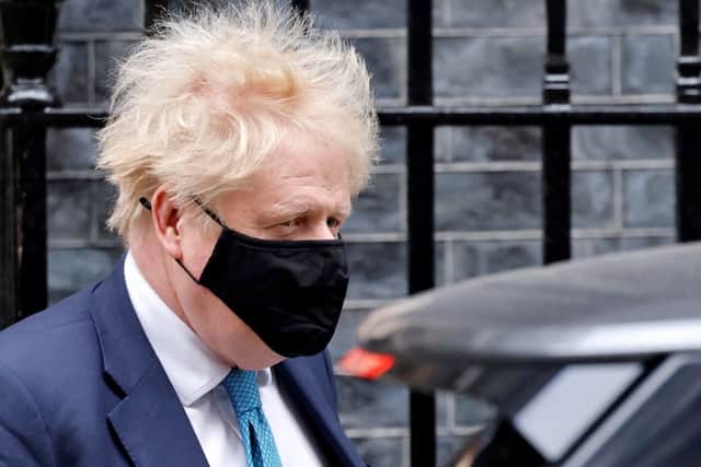 Prime Minister Boris Johnson leaves from 10 Downing Street on January 26, 2022, to take part in the weekly session of Prime Minister Questions (PMQs) at the House of Commons (Photo by TOLGA AKMEN/AFP via Getty Images)