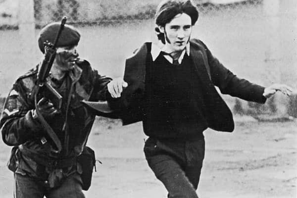 A British paratrooper takes a captured youth from the crowd on Bloody Sunday (Photo: Getty Images)
