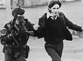 A British paratrooper takes a captured youth from the crowd on Bloody Sunday (Photo: Getty Images)