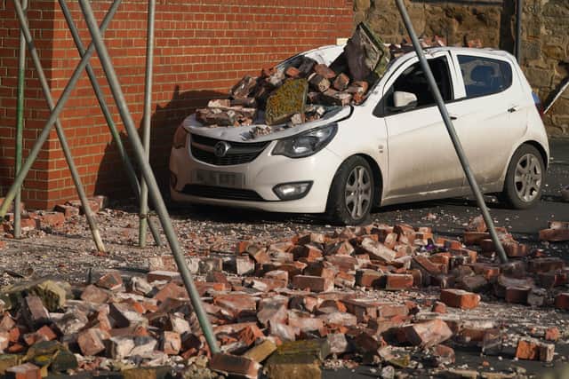 A car crushed by fallen bricks in Seaton Sluice, Northumberland after strong winds from Storm Malik (image: PA)