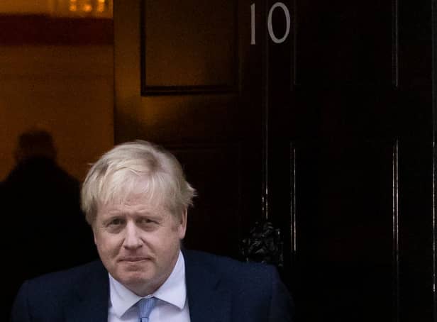 <p>Prime Minister Boris Johnson leaves 10 Downing Street to make a statement at Parliament.  (Photo by Dan Kitwood/Getty Images)</p>