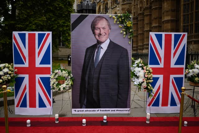 A large photograph of murdered MP David Amess was displayed outside the Houses of Parliament in October 2021  (Photo by Leon Neal/Getty Images)