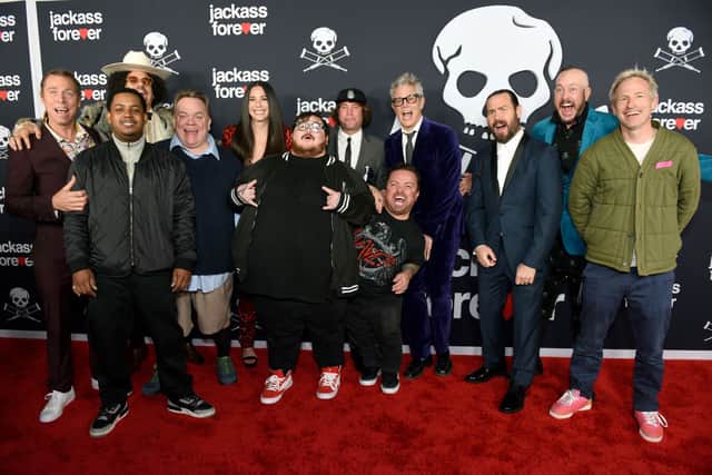 The cast of Jackass Forever: (L-R) Dave England, Jasper Dolphin, Eric Andre, Preston Lacy, Rachel Wolfson, Zach Holmes, Sean McInerney, Jason Acuna, Johnny Knoxville, Chris Pontius, Ehren McGhehey, and Spike Jonze (Photo: Vivien Killilea/Getty Images for Paramount Pictures)