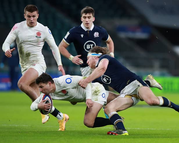 Ben Youngs of England is tackled by Hamish Watson during the Guinness Six Nations match between England and Scotland at Twickenham Stadium on February 06, 2021 in London