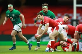 Tomos Williams of Wales passes the ball during the Guinness Six Nations match between Wales and Ireland at Principality Stadium on February 07, 2021 in Cardiff