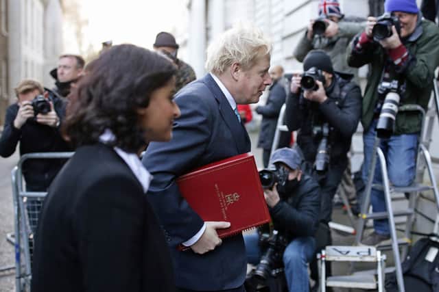 Prime Minister Boris Johnson crossing London’s Downing Street with Munira Mirza, who has resigned after the PM failed to apologise for using a “scurrilous” Jimmy Savile slur (image: PA)