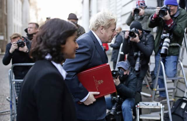 Prime Minister Boris Johnson crossing London’s Downing Street with Munira Mirza, who has resigned after the PM failed to apologise for using a “scurrilous” Jimmy Savile slur (image: PA)