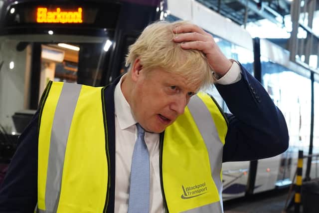 Britain’s Prime Minister Boris Johnson gestures as he speaks during a visit the Blackpool Transport Depot on 3 February (image: by Peter Byrne/POOL/AFP via Getty Images)