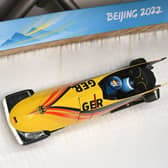 Germany’s bobsleigh team members practice at the Yanqing National Sliding Centre. (Photo by DANIEL MIHAILESCU/AFP via Getty Images)