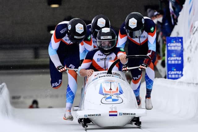 The Netherlands’ Ivo de Bruin, Jelen Franjic, Dennis Veenker and Joost Dumas take the start of the 4-man bobsleigh race of the IBSF Bob & Skeleton World Cup. (Photo by INA FASSBENDER/AFP via Getty Images)
